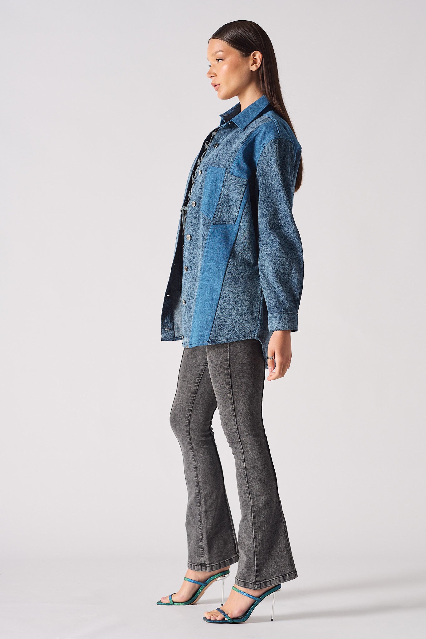 Back view of a model in the women's acid wash jean shirt.