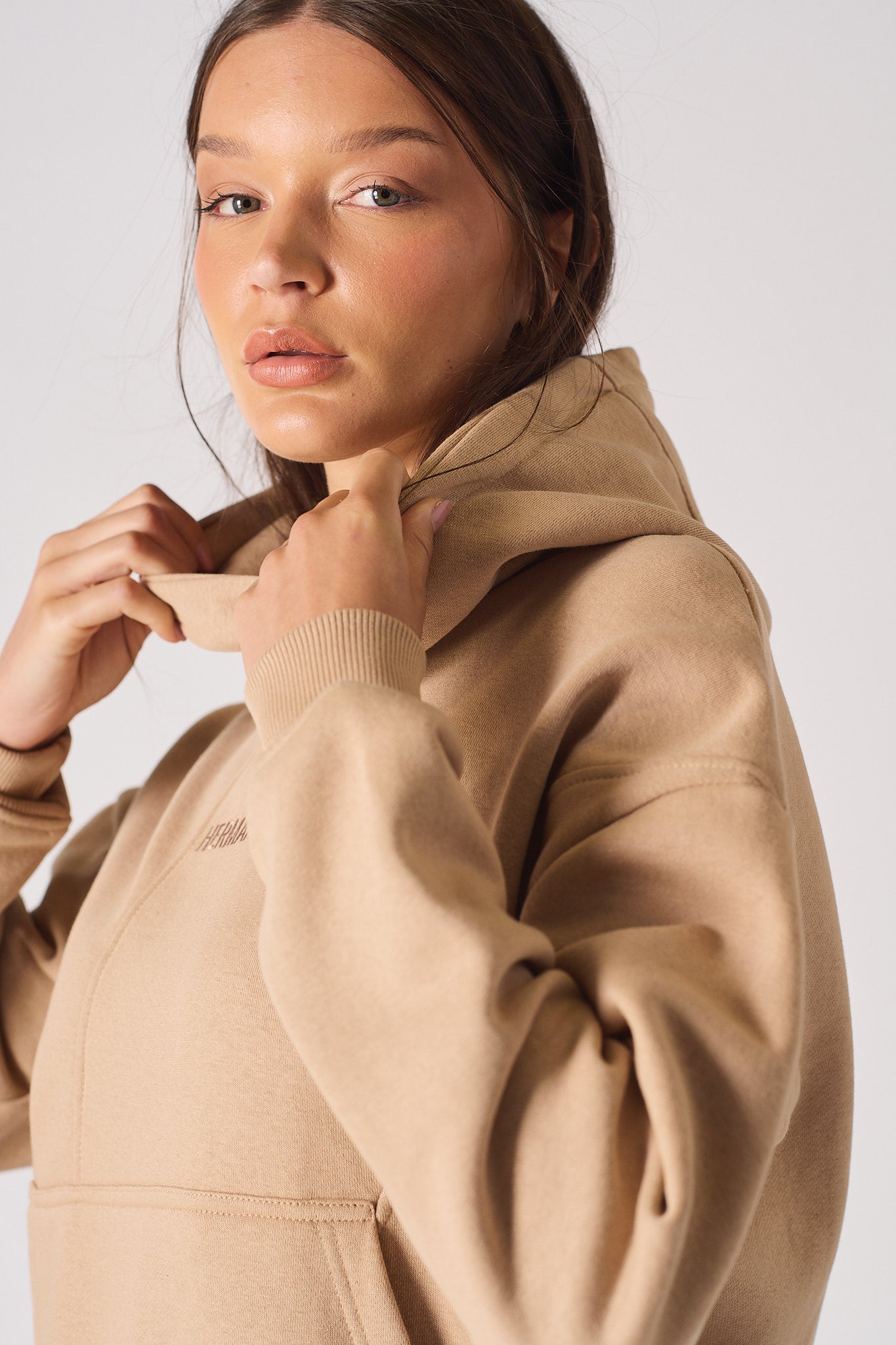 Close up detail of the ribbed sleeve cuff on womens beige hoodie