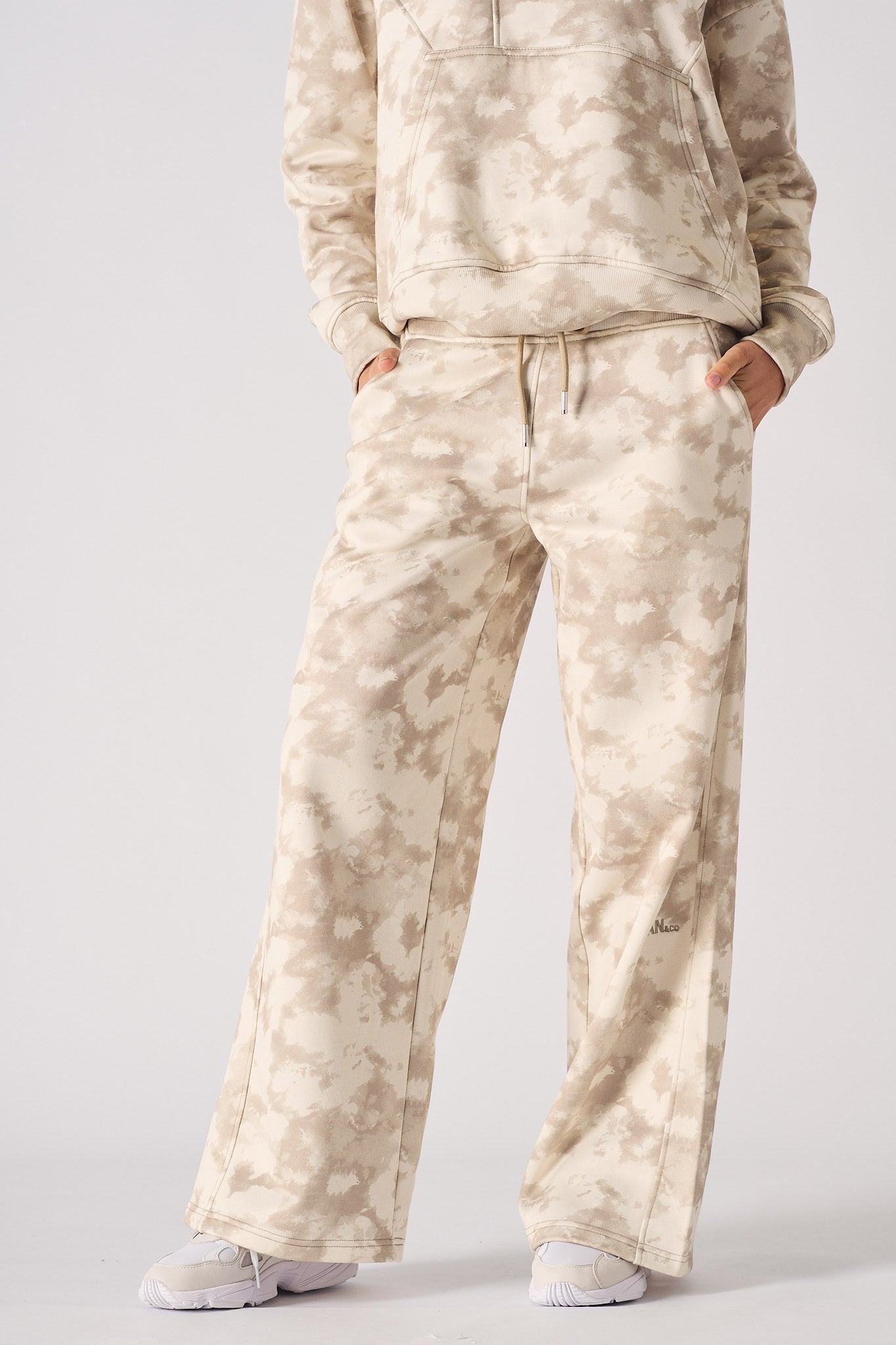 Close up view of the abstract tie dye pattern on womens wide leg joggers