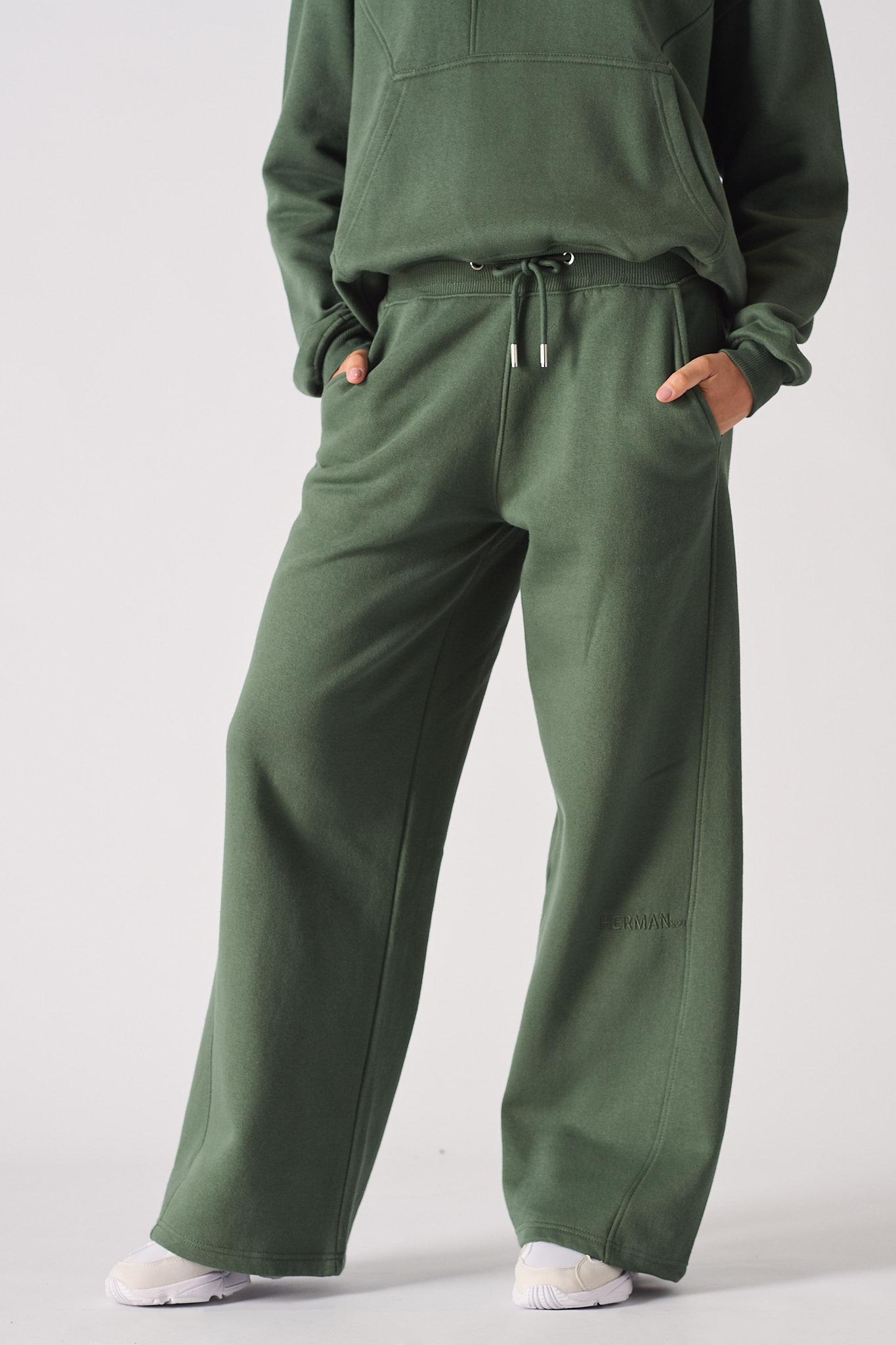 Close-up of the dark green joggers for women showing the wide-leg fit.