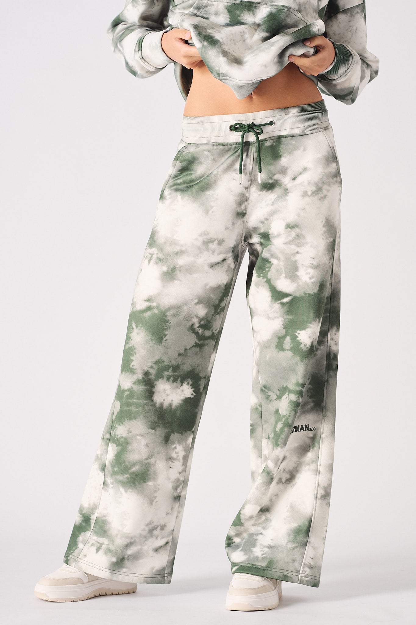 Front close-up of the green tie-dye wide-leg joggers for women.