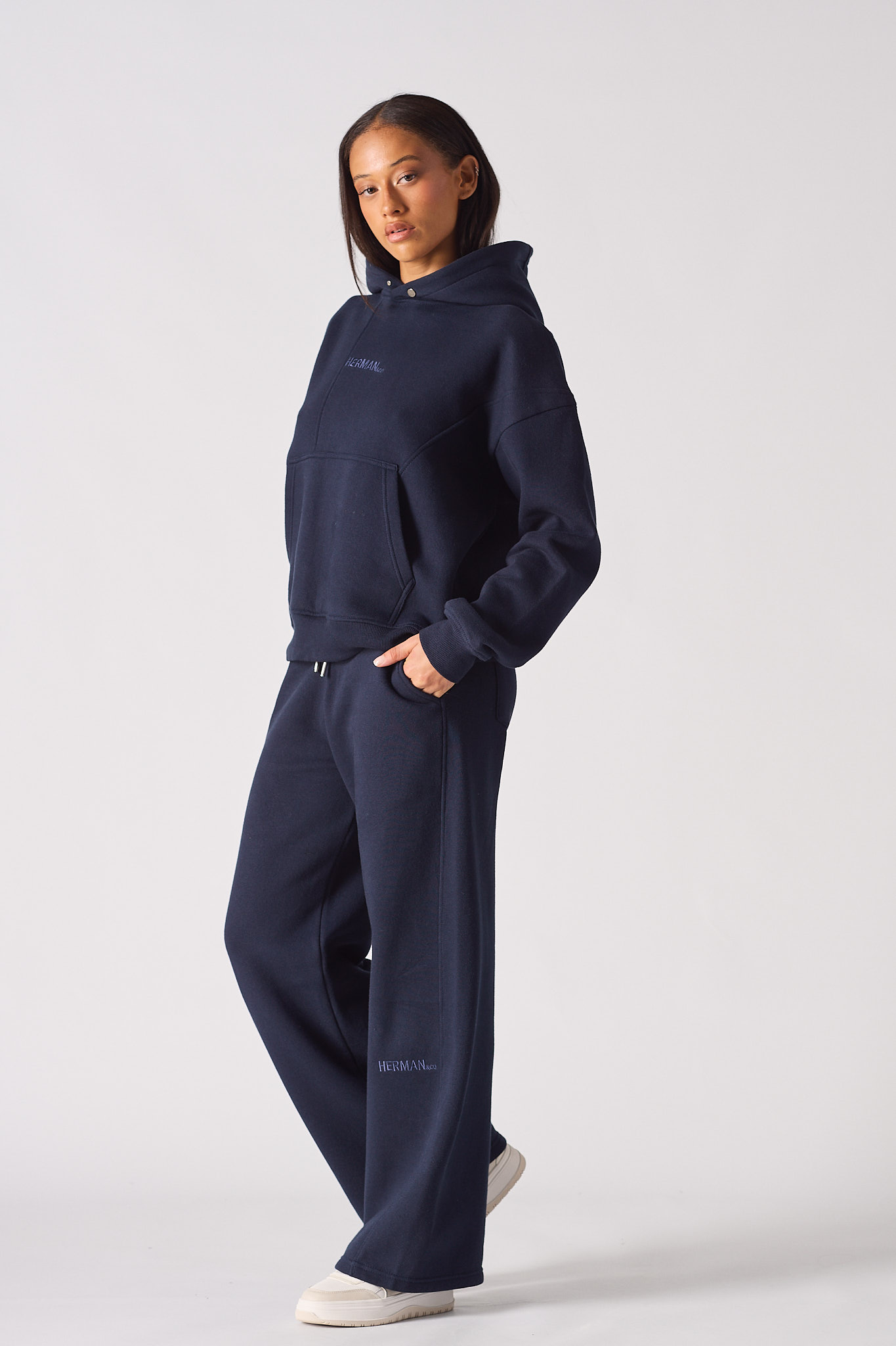 Side profile of model wearing a comfortable dark green hoodie