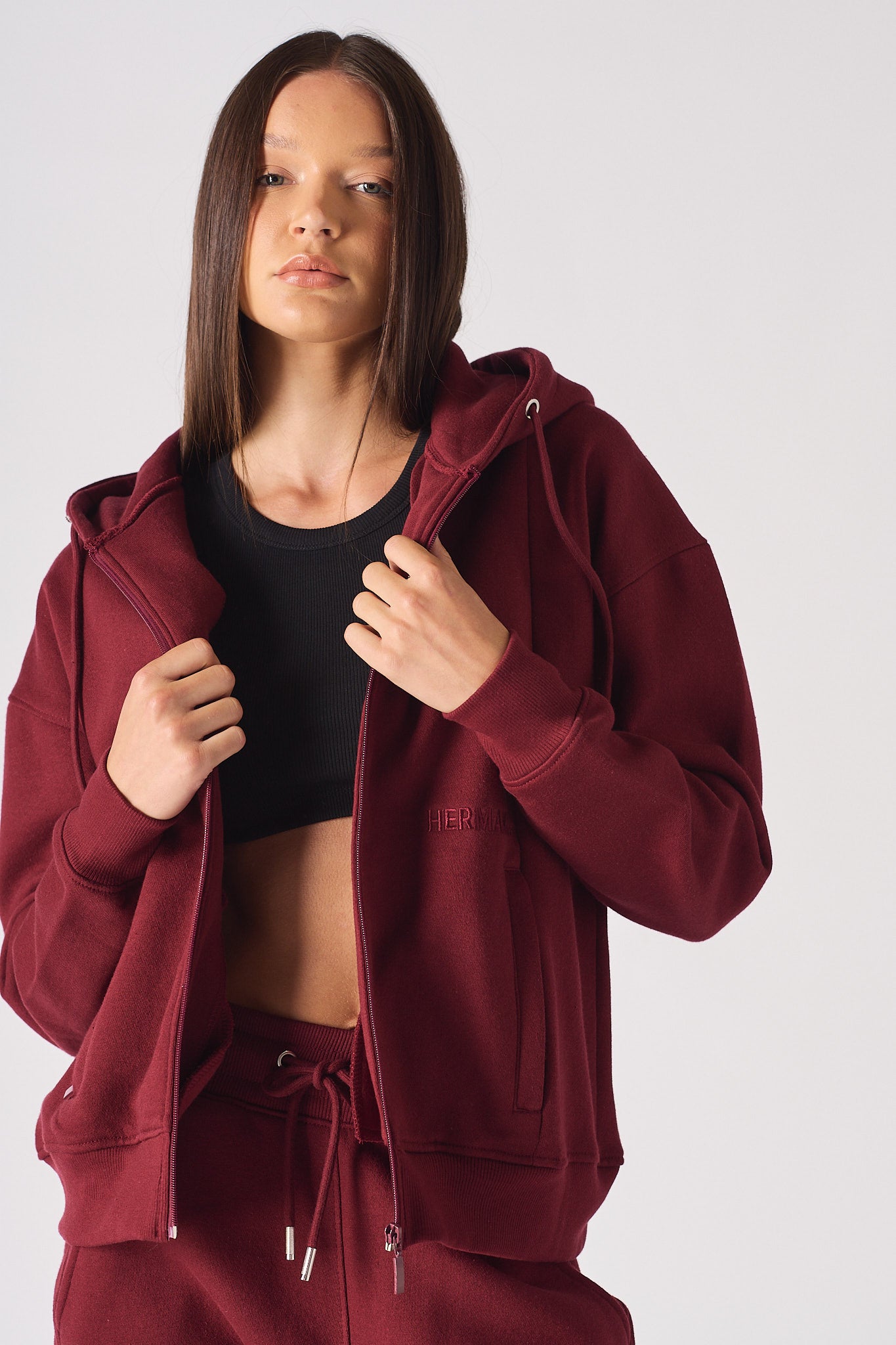 Front view of the women's red zip-up hoodie.