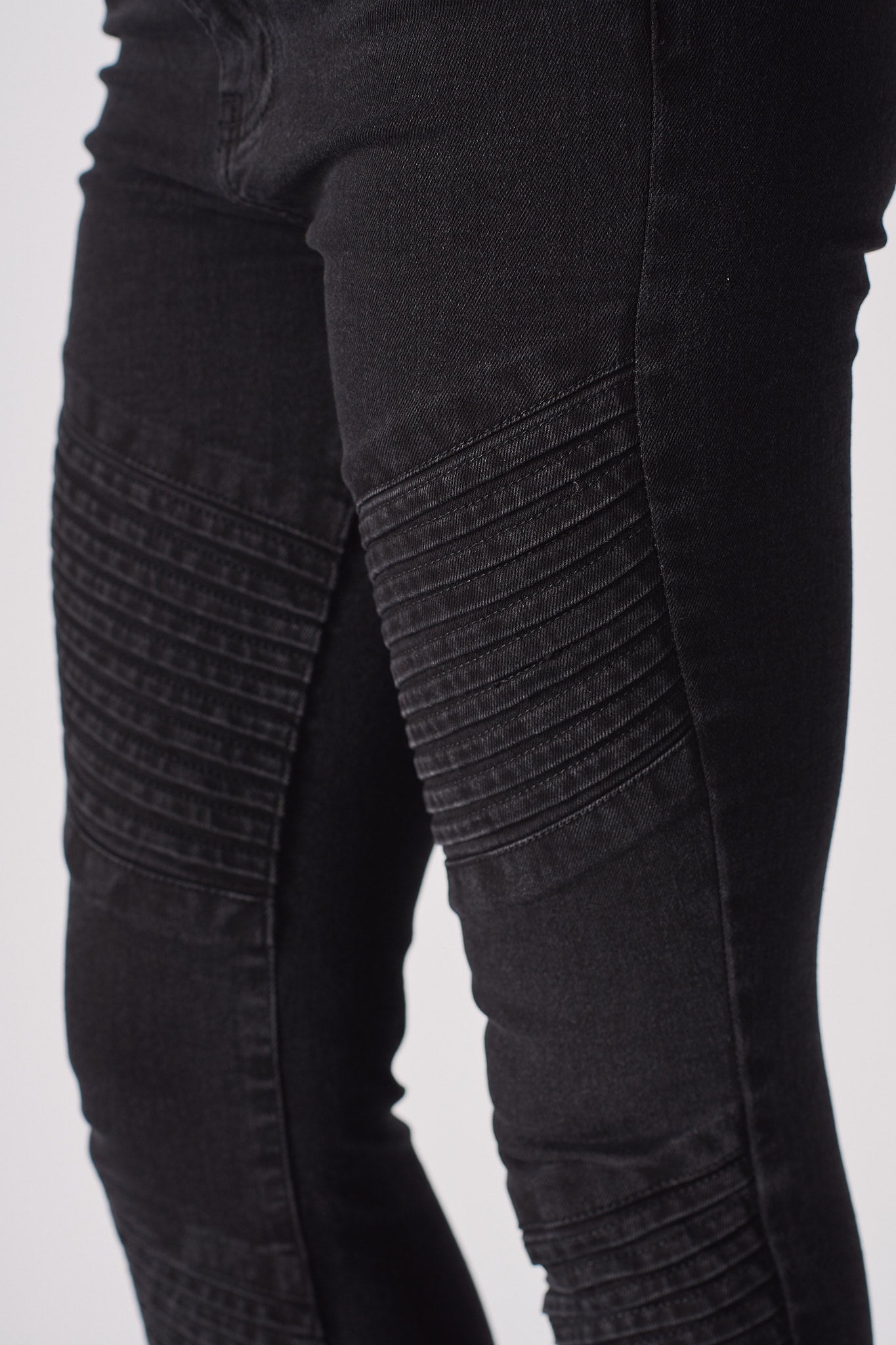 Detailed view of the ribbed biker panel on the skinny jeans for women.