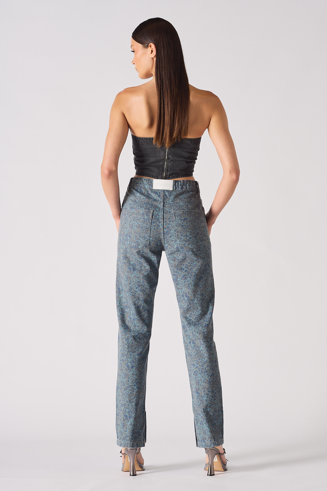 Back view of the strapless denim corset, showing the zip closure.