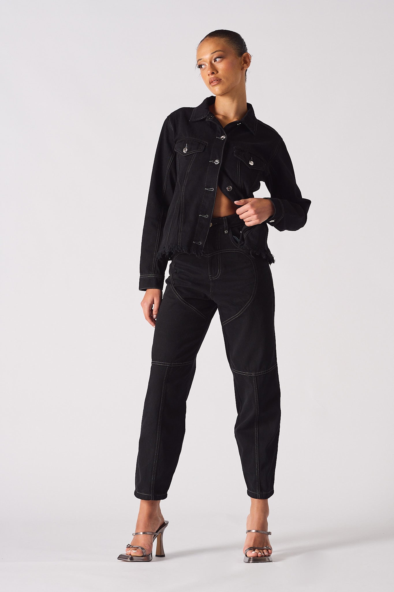 A model showing a full look with the women's tapered denim jacket.