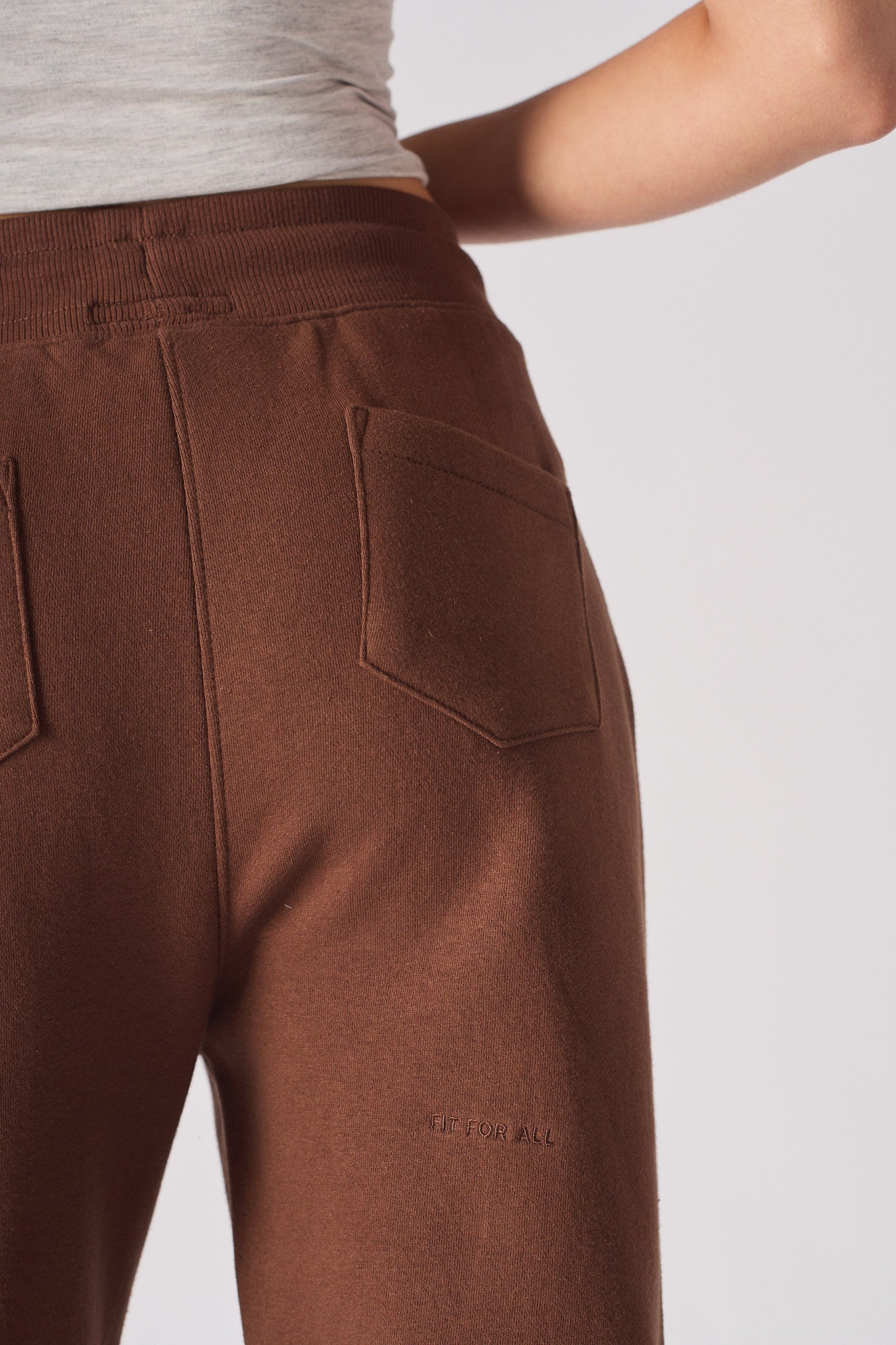 Close-up of the hip and back pocket on the women's brown tapered jogger.