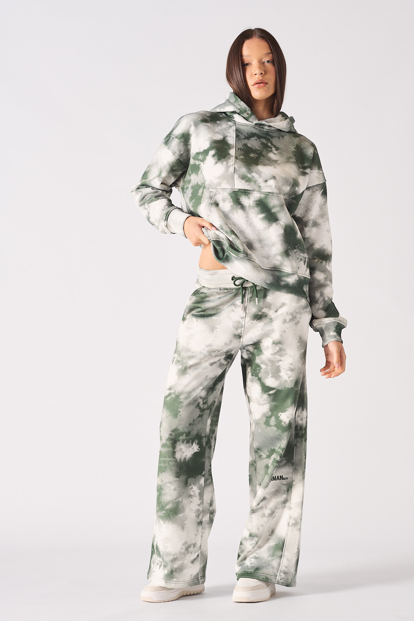 Rear close up view of the hood and pattern on womens dark green tie dye hoodie