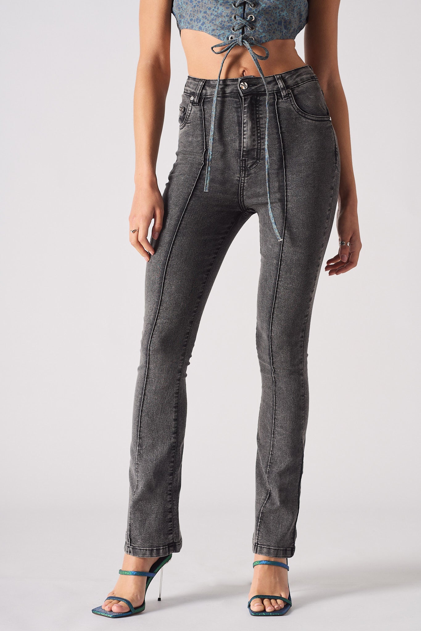 Front view of the women's grey acid wash flare jeans with front seam detail.