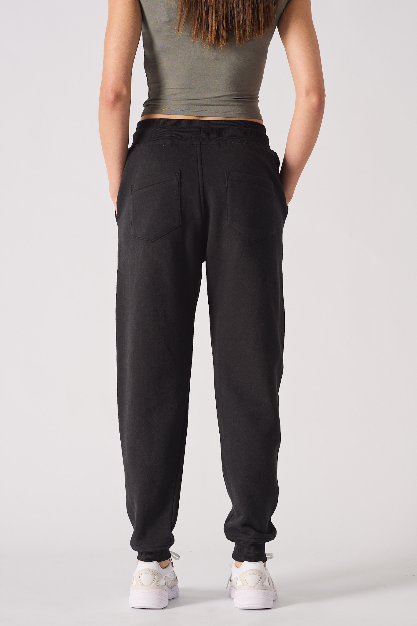 Back view of the women's tapered joggers with back pocket details