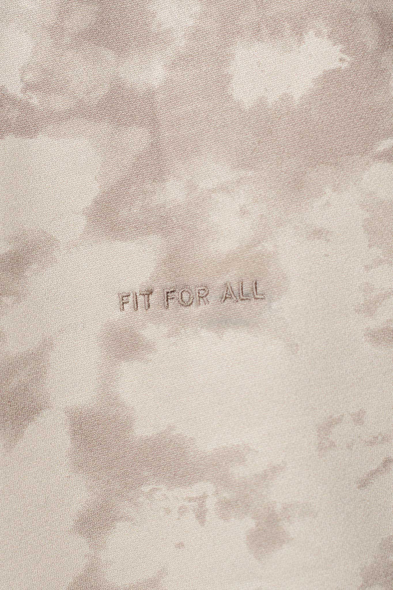 Close up detail of the abstract beige tie dye fabric pattern