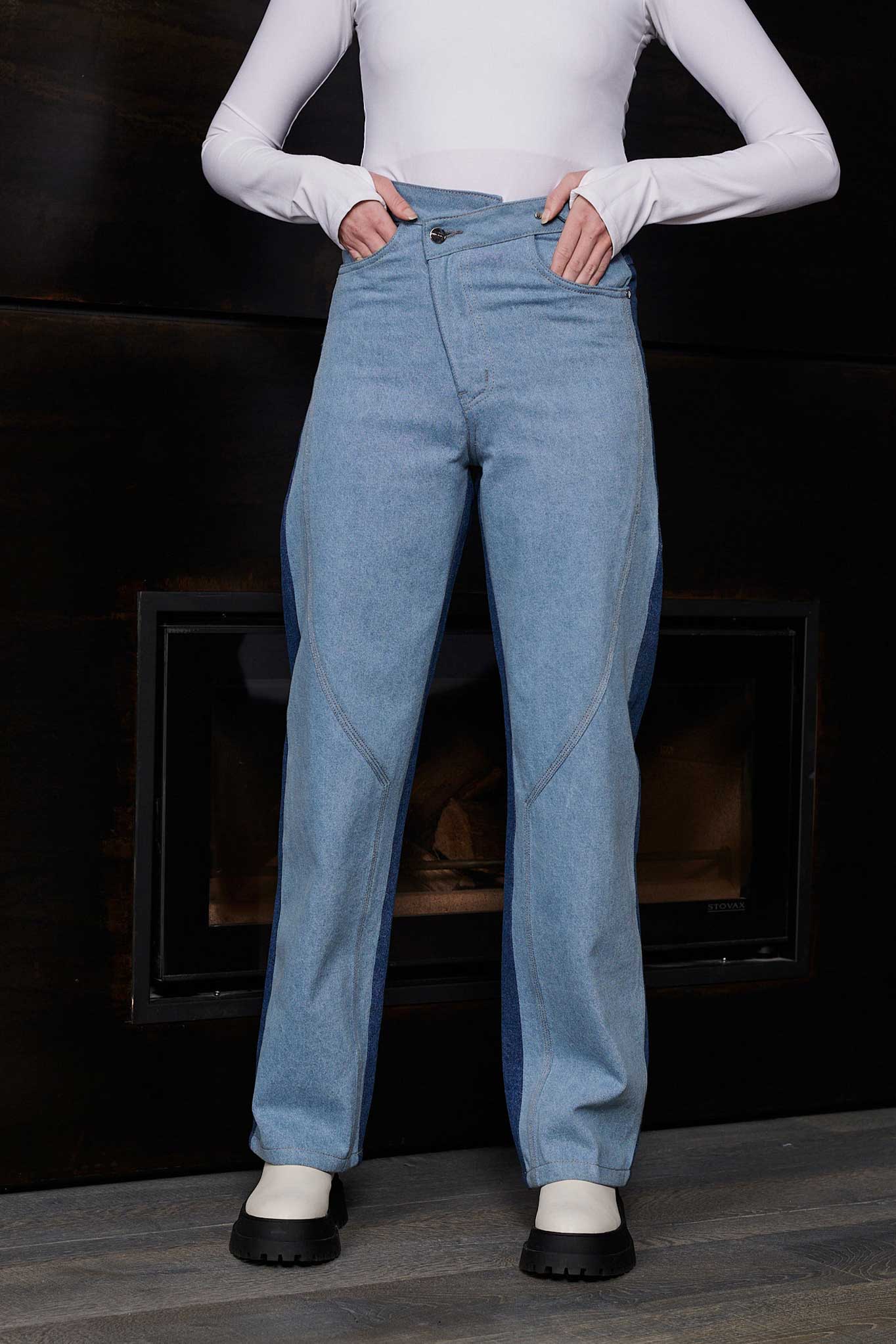 Close-up of the front showing the baggy fit of the half wash jeans.