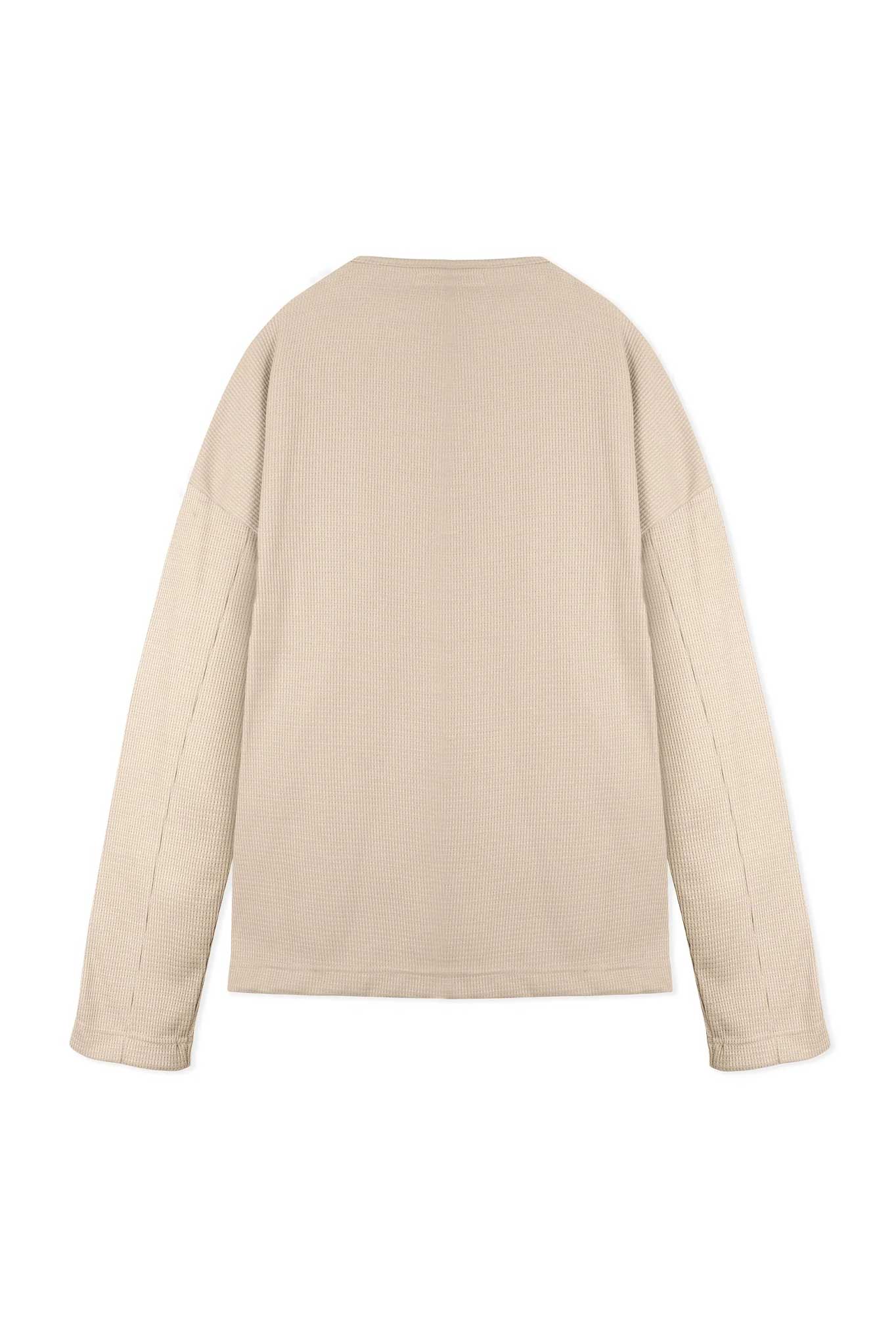 Back flat lay view of simple and stylish beige v neck jumper