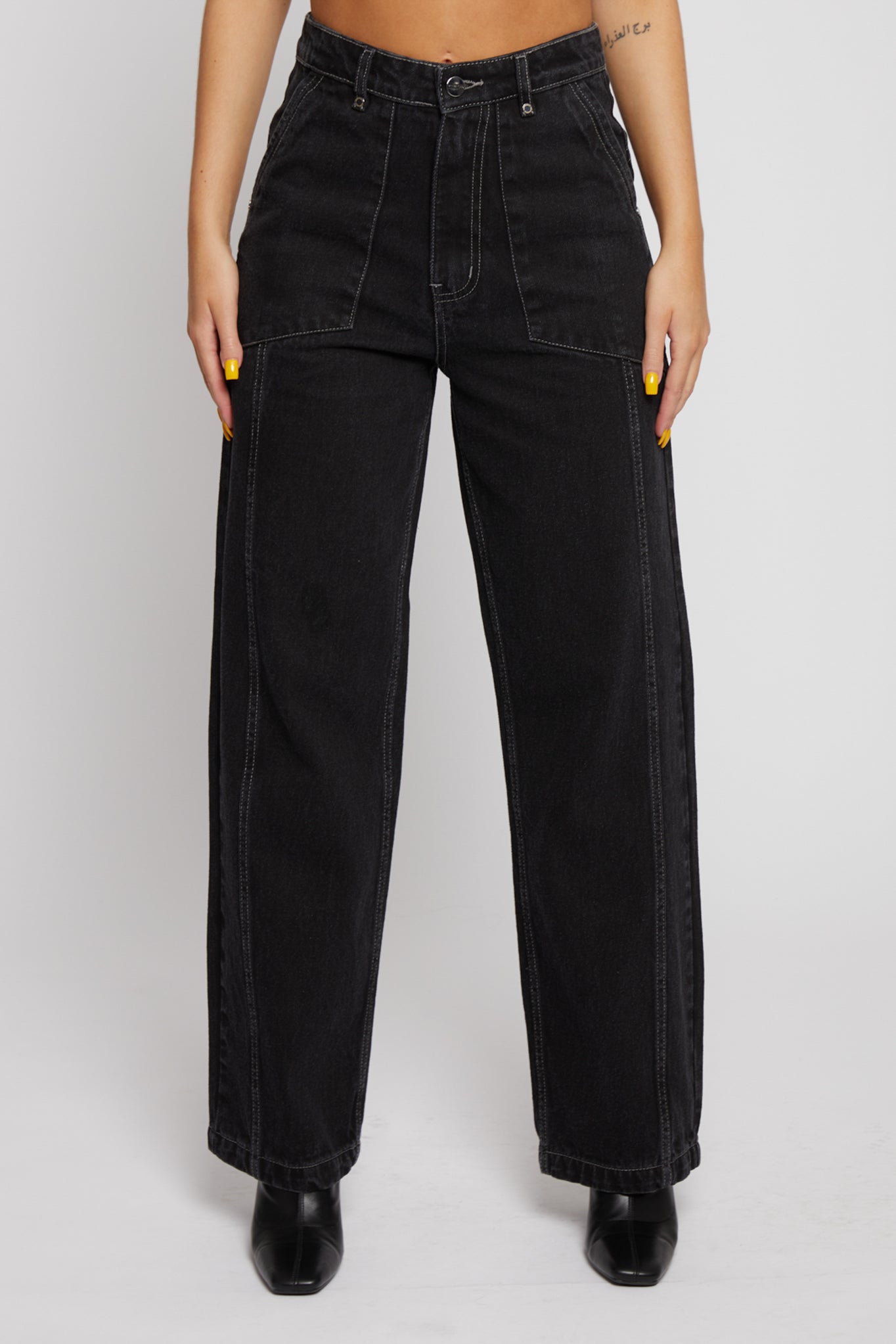 Front close-up of the women's black wash straight leg jeans.