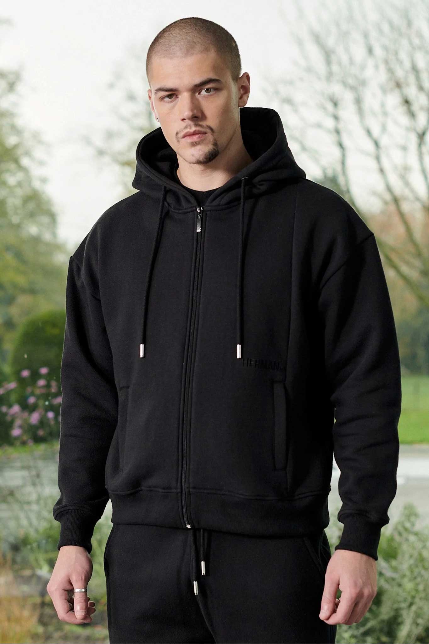 Close up detail of the side pocket on black zip up hoodie men