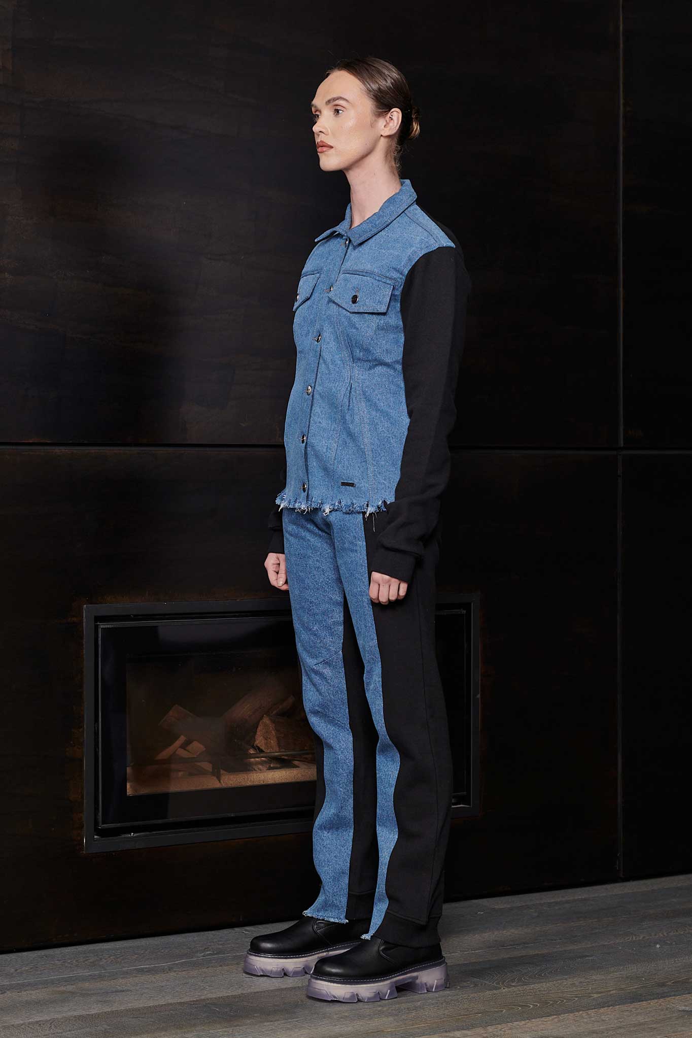 Side profile of a model showing the fit of the fleece denim jacket for women.