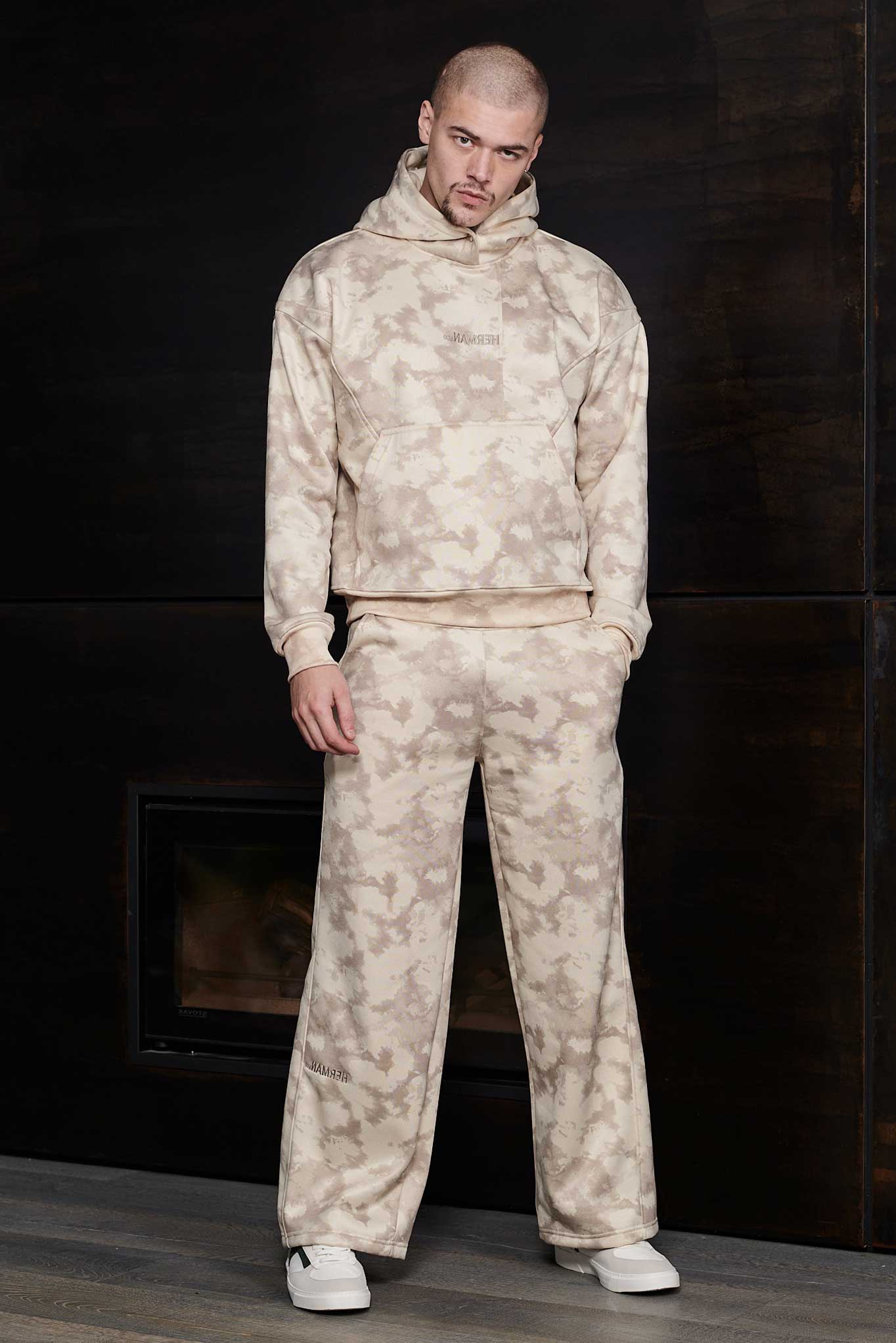 Front view of mens tie dye hoodie in beige worn as a matching set