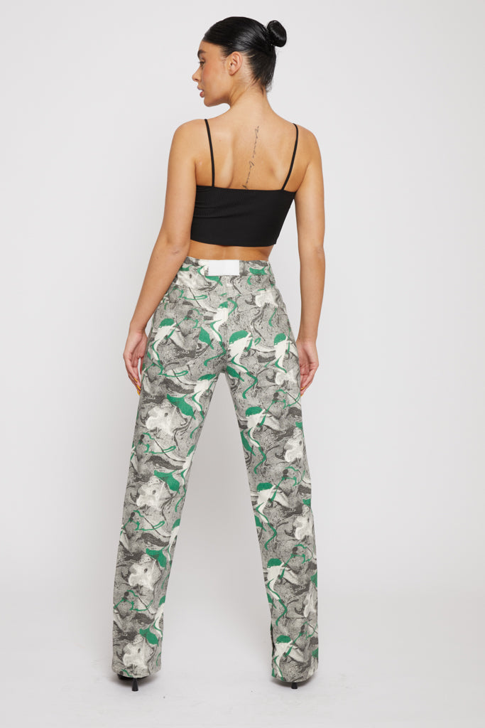 Back view of a model in the women's psychedelic print straight-leg jeans.