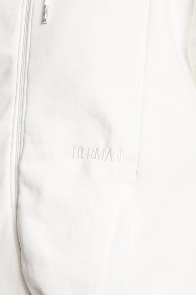 Close up view of the side pocket detail on mens white zip up hoodie
