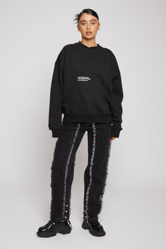 Front view of model wearing limited edition black crewneck sweatshirt for women with matching joggers