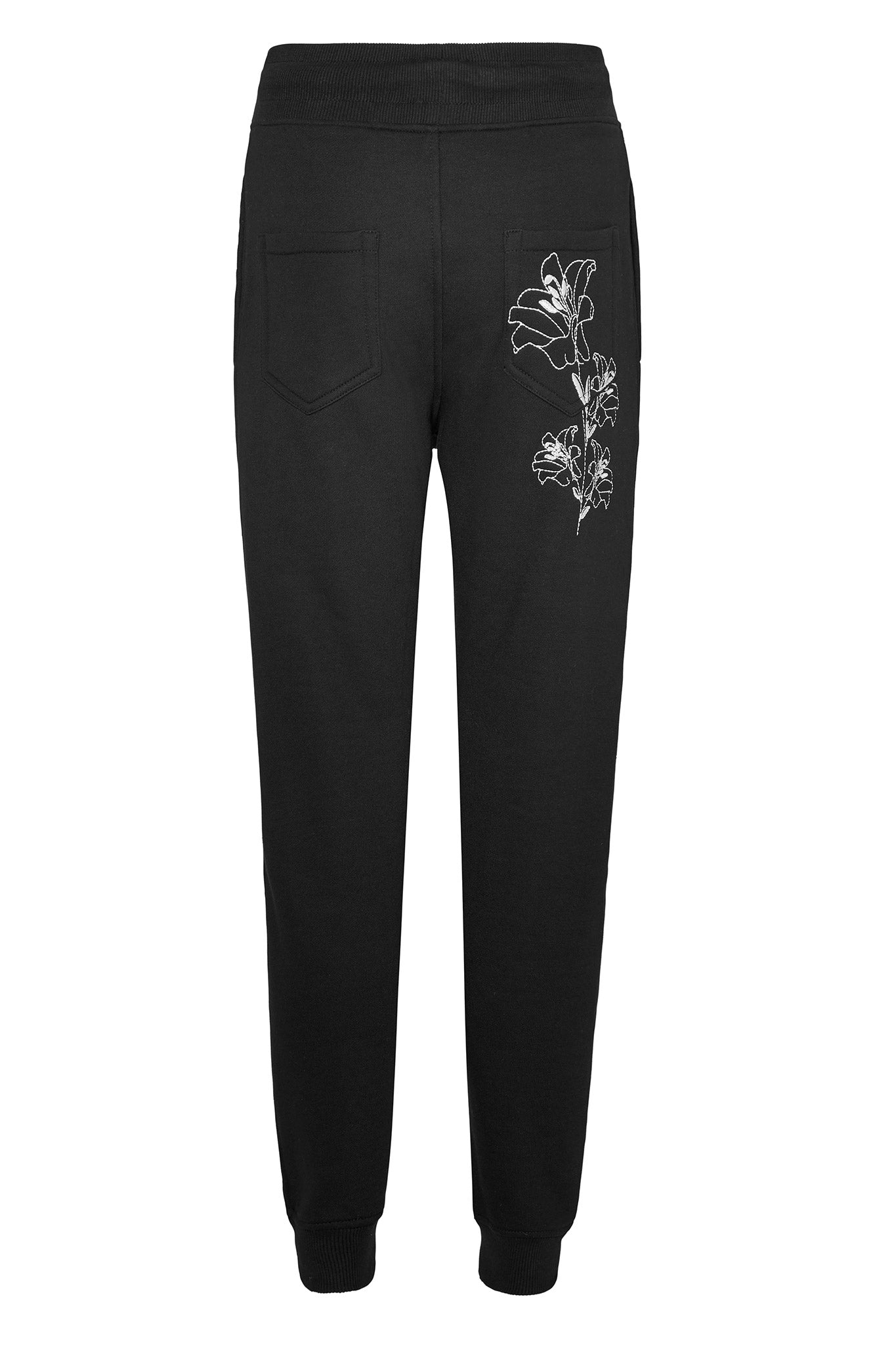 Back view of the women's tapered joggers with floral embroidery, laid flat