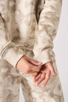 Close up texture view of the unique beige and cream tie dye pattern