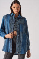 Full view of a model wearing the blue acid wash denim shirt.