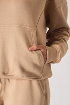 Close up texture view of the soft fabric and pocket stitching on womens hoodie