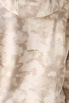 Rear close up view showing the hood structure on womens beige sweatshirt