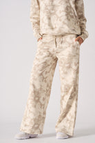 Close up view of the abstract tie dye pattern on womens wide leg joggers