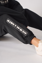 Rear view showing the relaxed fit of womens black oversized joggers