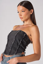 Side profile close-up of the black wash denim corset top.