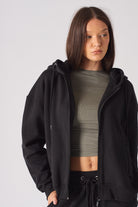 Detailed texture view of the soft fabric on black zip up hoodies for women