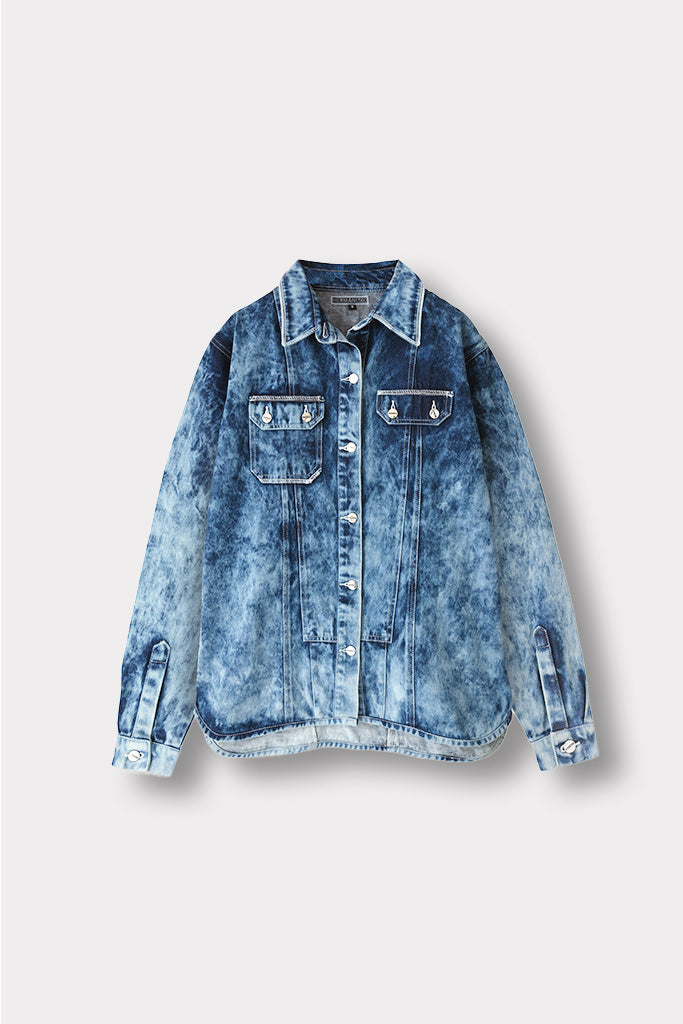 Front view of the women's bleach wash seam detail denim shirt, laid flat.