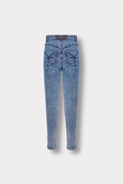 Back view of the blue acid wash skinny jeans with logo patch, laid flat