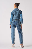 Back view of a model wearing the blue two-tone denim jacket.