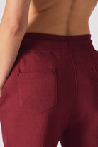 Close up view showing the soft fabric texture of the burgundy joggers