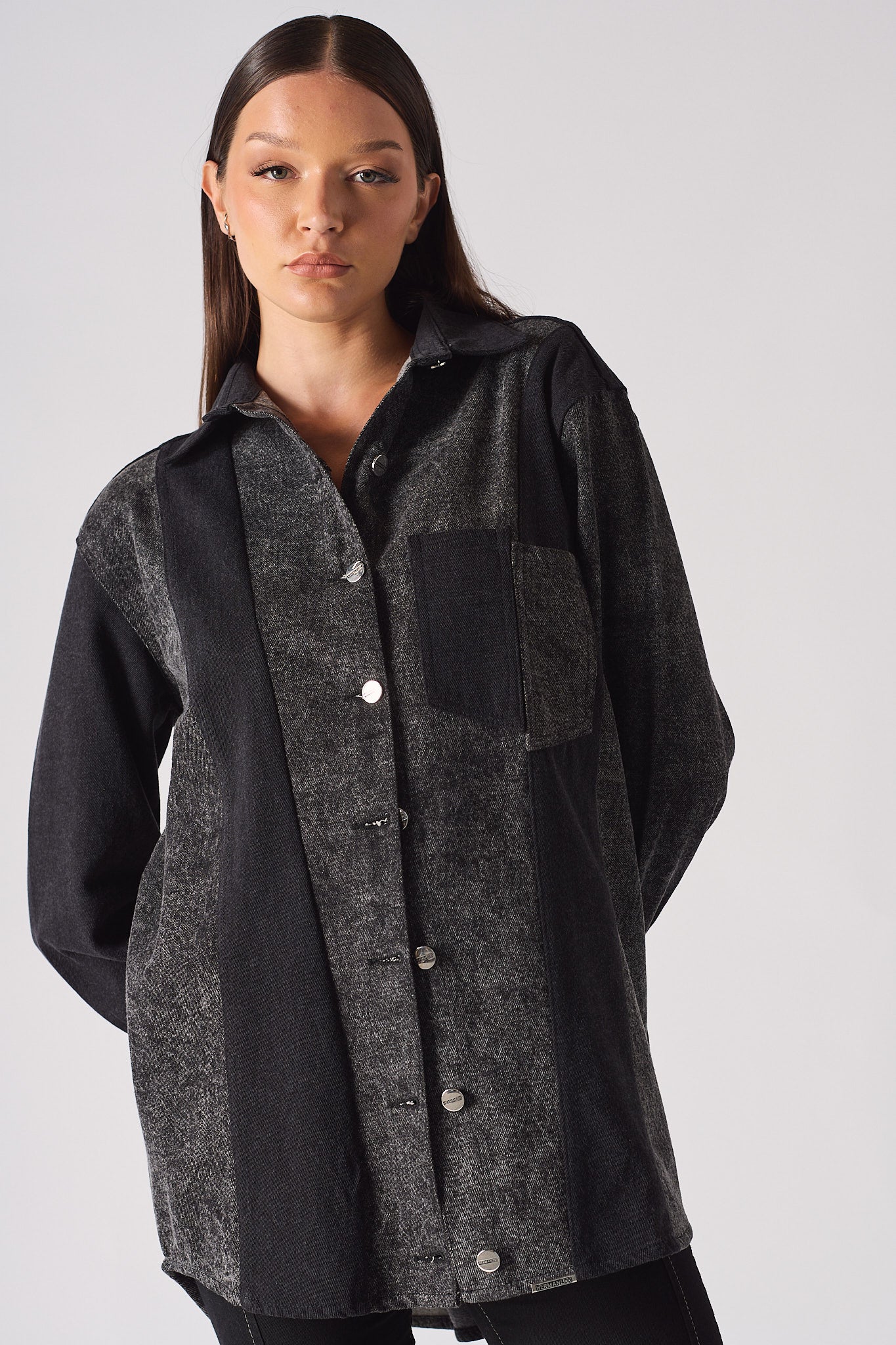 Close-up of the women's contrast panel acid wash denim shirt.