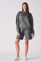 Back flat lay view of simple cool grey crew neck jumper for women