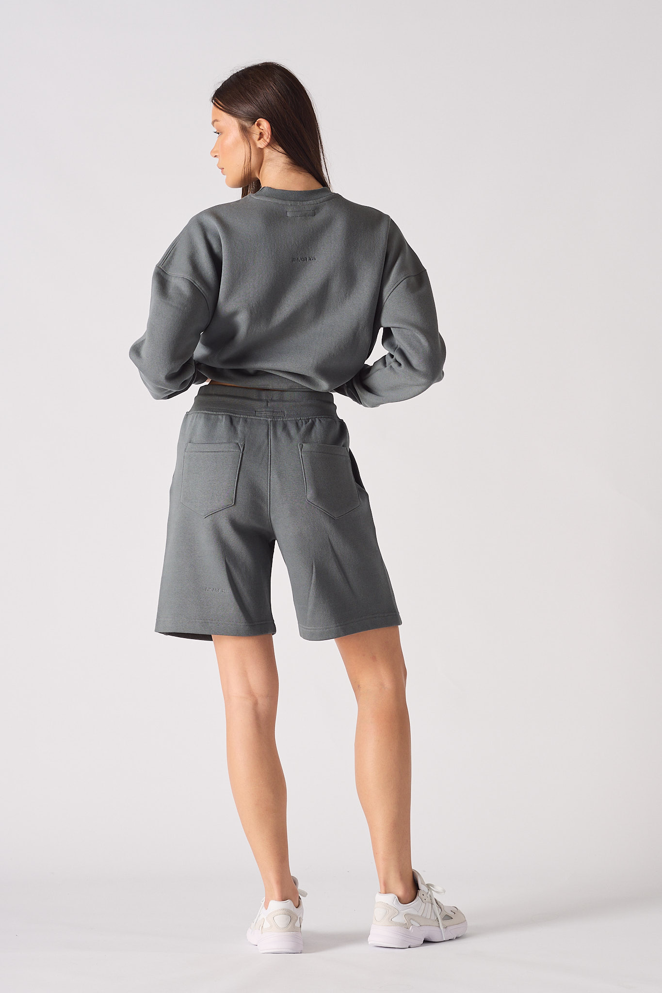 Rear view of womens relaxed fit fleece shorts in cool grey