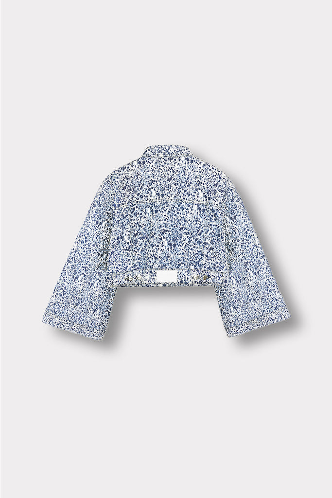 Back view of the cropped marble print denim jacket laid flat.
