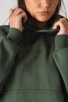 Back flat lay view of plain dark green hoodie for women