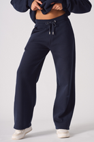 Front view of the dark navy joggers for women showing the wide-leg fit.