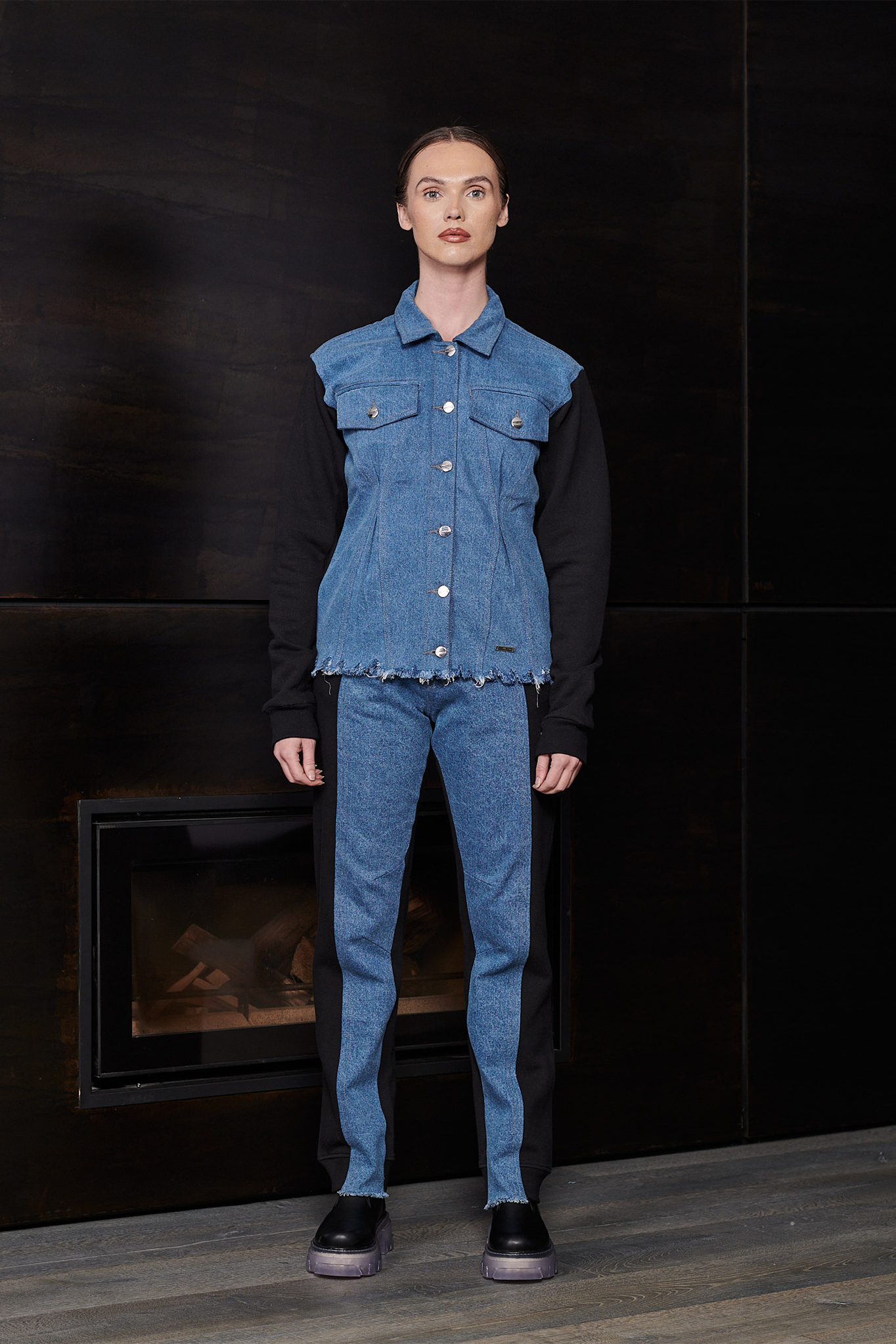 Model wearing the denim and fleece joggers with a matching vest