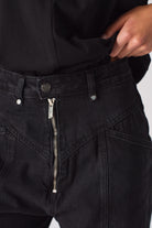 Close-up of the statement silver zip fly on the women's front zip jeans.