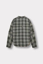 Back view of the green check oversized shirt laid flat.