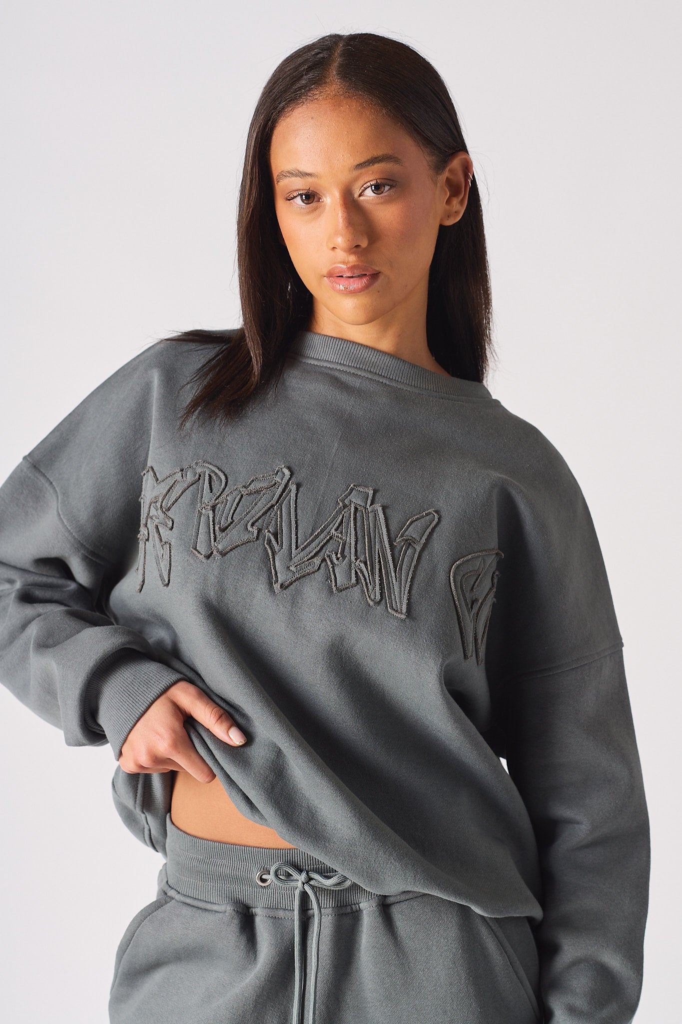 Detailed view of the high crew neck structure on womens grey oversized sweatshirt