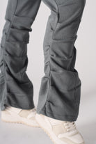 Model standing in grey ruched flare joggers showing the front fit