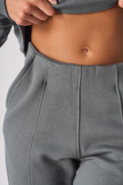 Flat lay front view of essential womens grey ruched flare joggers