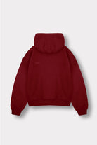 Back view of the red zip-up hoodie for women laid flat.